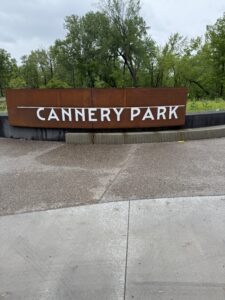 A rust-colored metal sign with 